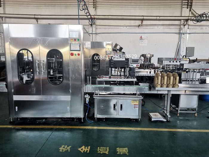 Engine oil lubricating oil Filling packaging Machine Line with Hooking Cap and sealing cap machi.jpg